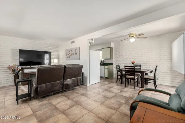 a kitchen with granite countertop a sink a stove and cabinets