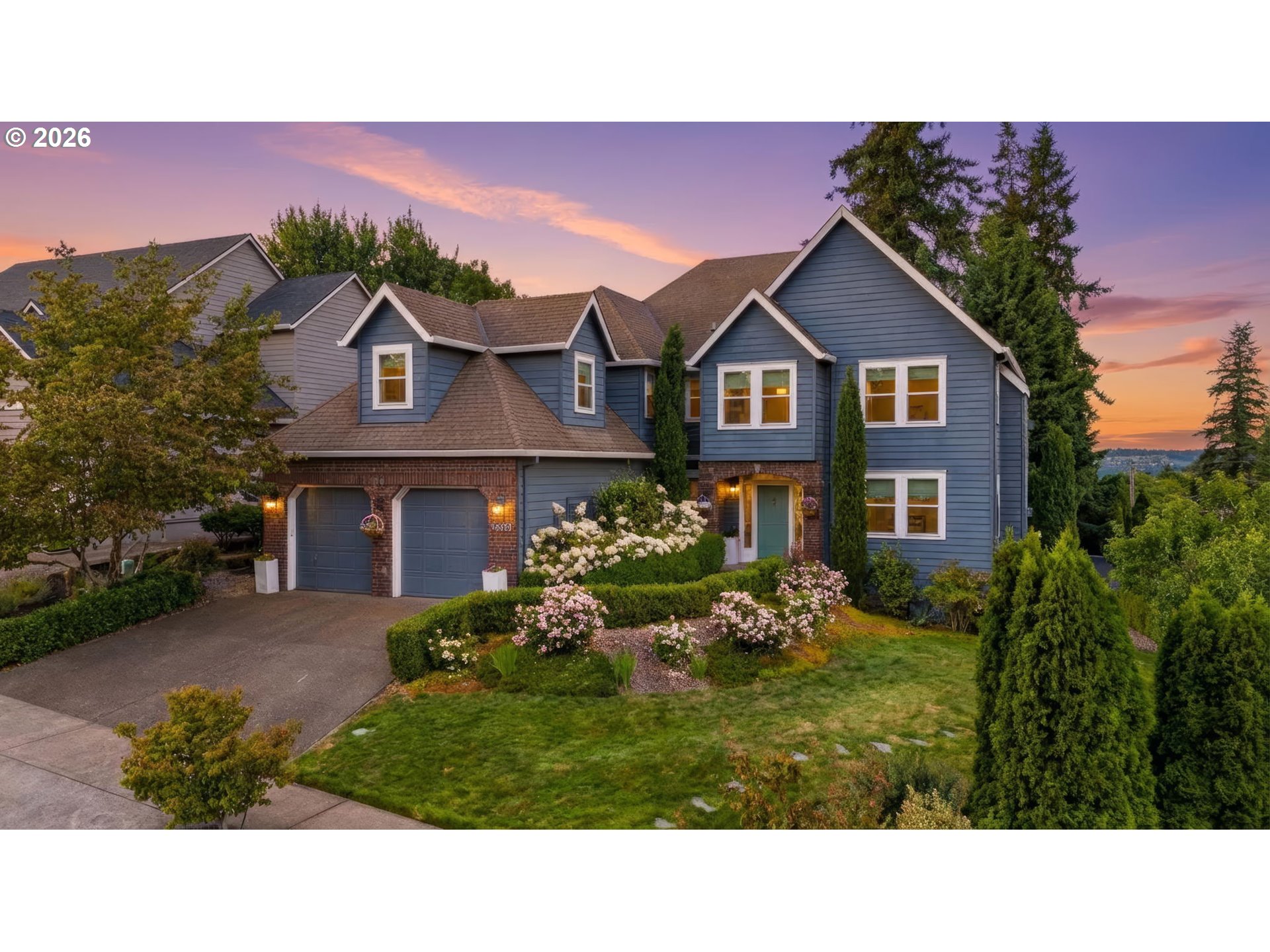 a black and white house with a yard