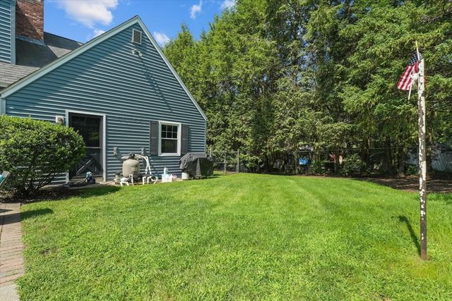 an aerial view of a house with yard swimming pool and outdoor seating