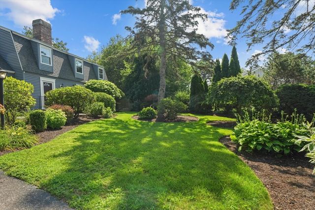 a view of a garden with a building