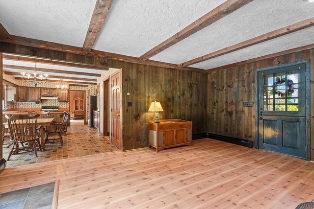 a bedroom with a bed and wooden cabinets