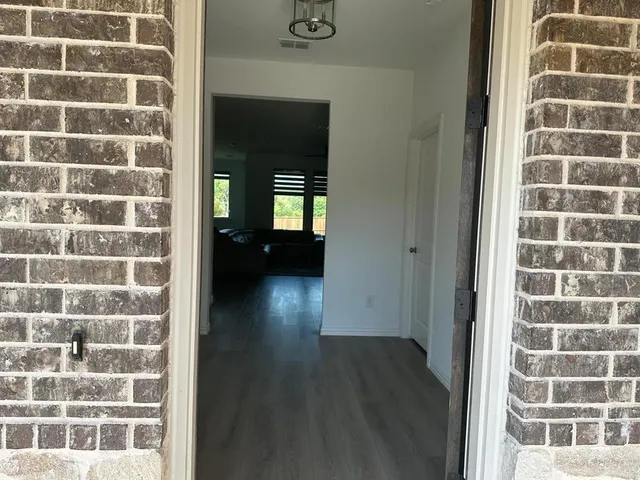 a view of a brick house with a window
