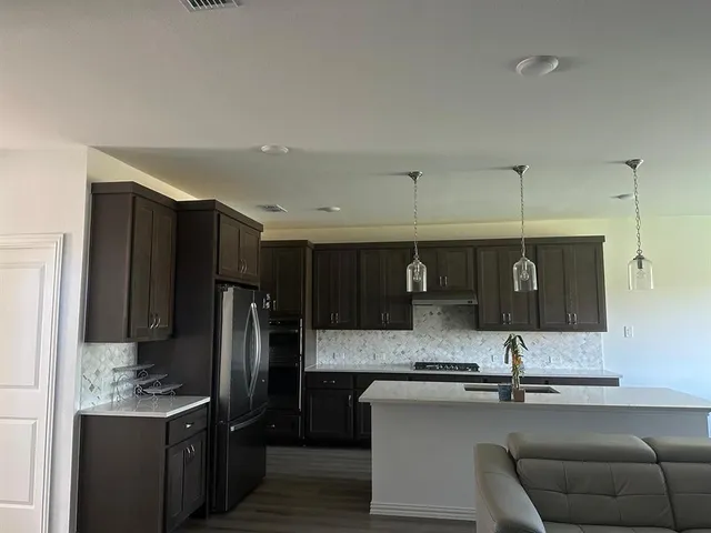 a bathroom with double vanity sink and a mirror