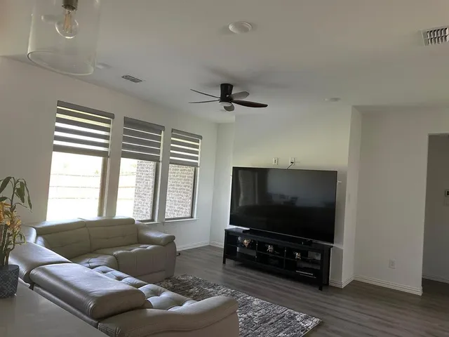 a kitchen with kitchen island a counter space appliances and cabinets