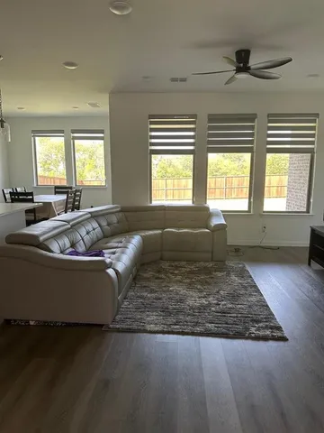 a kitchen with stainless steel appliances granite countertop a refrigerator and a stove