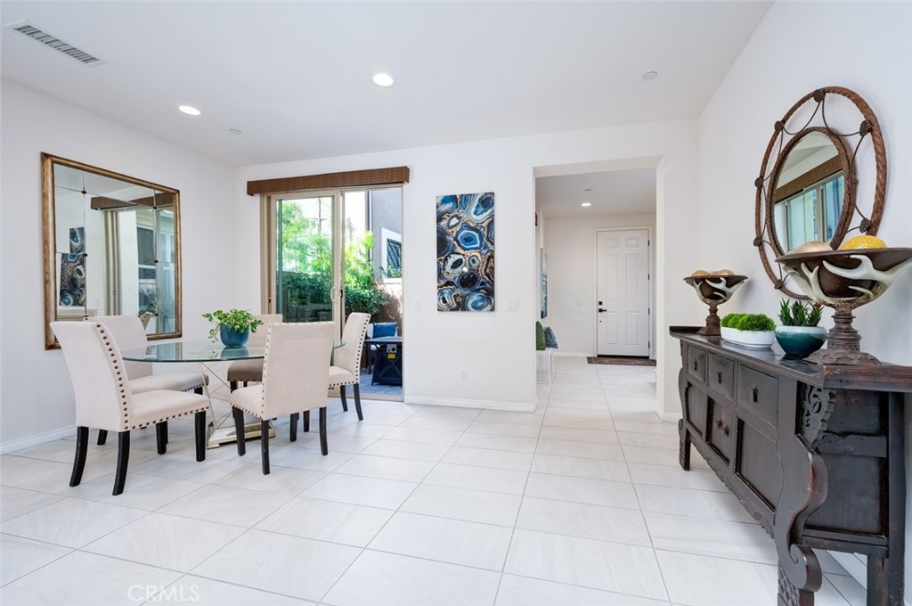 126 Brambles Irvine, CA 92618 - Photo 20 of 59 a view of a dining room with furniture window and outside view