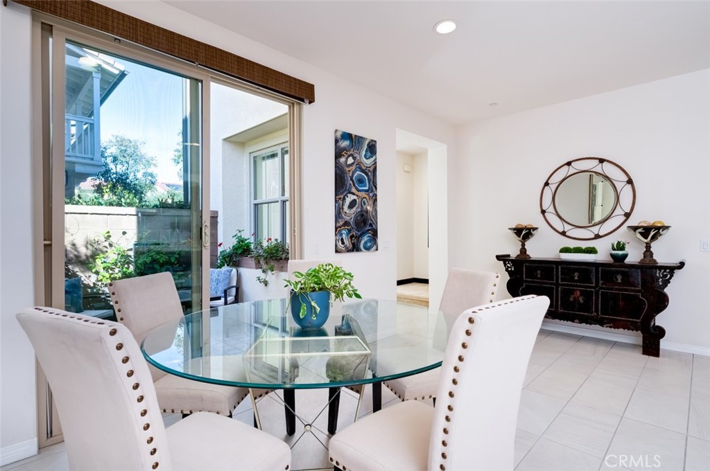 126 Brambles Irvine, CA 92618 - Photo 21 of 59 a view of a dining room with furniture window and wooden floor