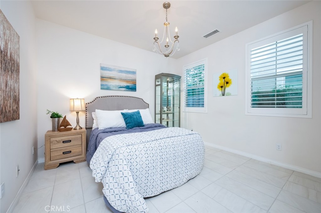 126 Brambles Irvine, CA 92618 - Photo 23 of 59 a bedroom with a bed and a window