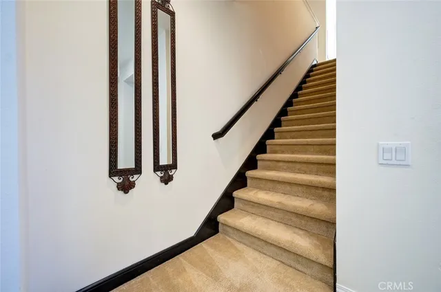 a spacious bedroom with a bed and window