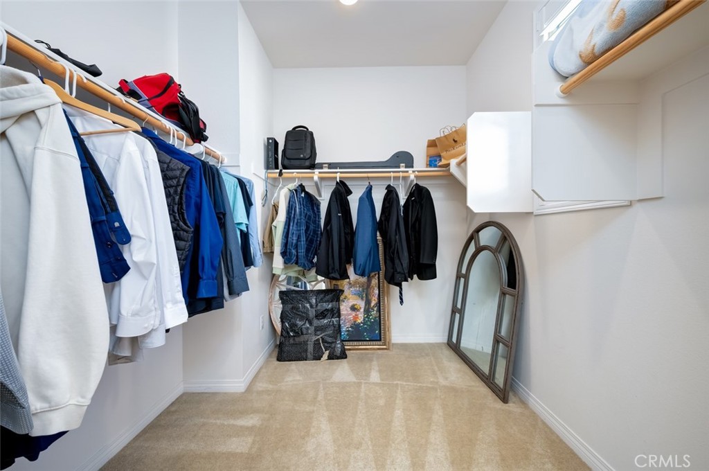126 Brambles Irvine, CA 92618 - Photo 35 of 59 a view of walk in closet with clothes and shoes