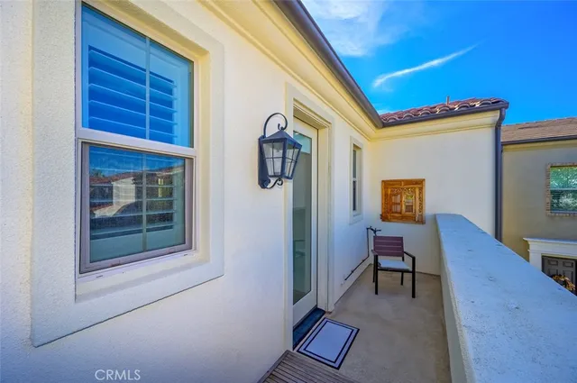 a view of a livingroom with wooden floor and a flat screen tv