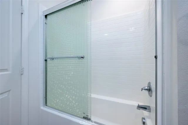 a view of a chair and table in the backyard