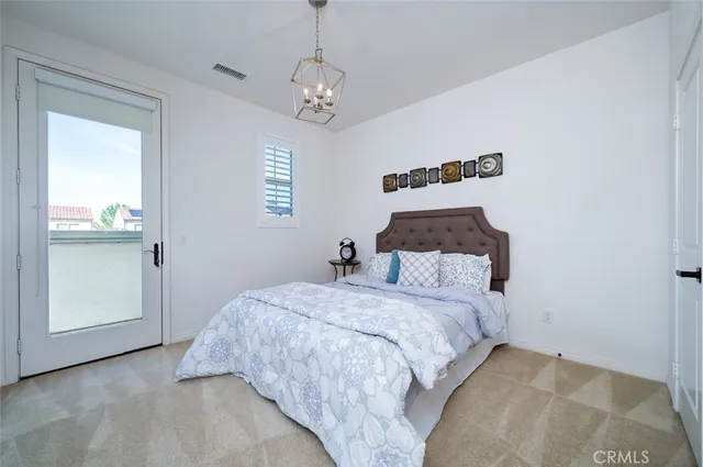 a view of a white house with a yard