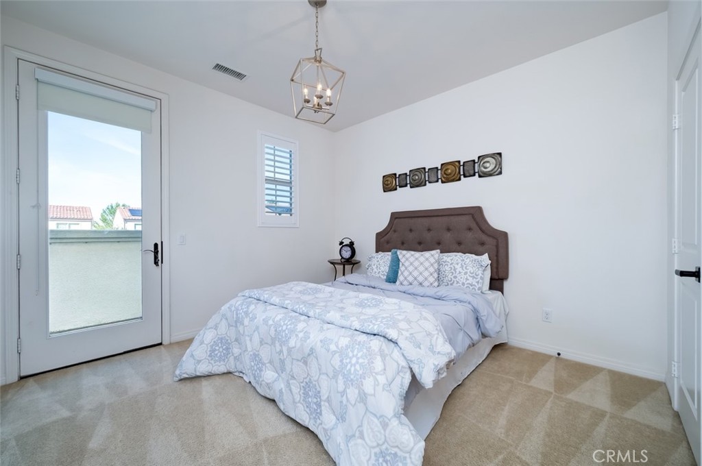 126 Brambles Irvine, CA 92618 - Photo 46 of 59 a bedroom with a large bed and a window