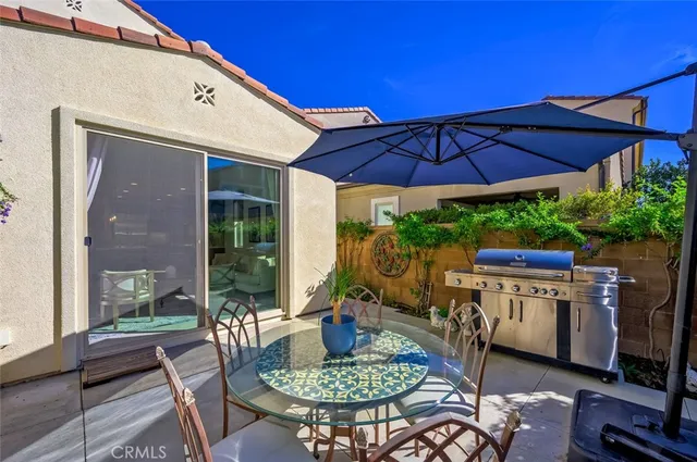 a view of a brick house with a wooden fence