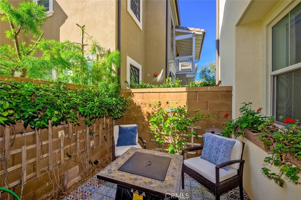 126 Brambles Irvine, CA 92618 - Photo 54 of 59 a view of a chair and table in the backyard