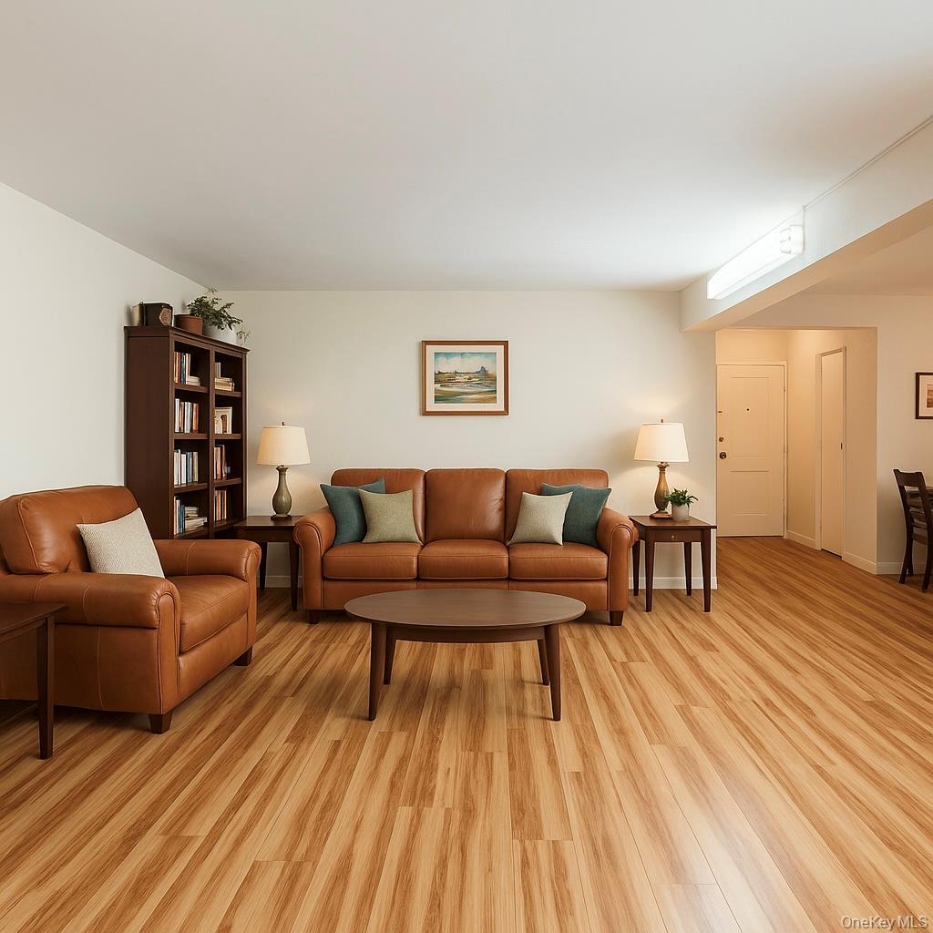 138-15 Franklin Avenue, Unit 221 Queens, NY 11355 - Photo 1 of 9 a living room with furniture and a wooden floor