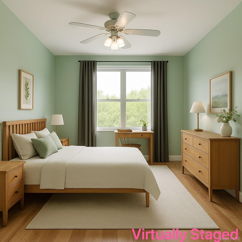 138-15 Franklin Avenue, Unit 221 Queens, NY 11355 - Photo 4 of 9 a bedroom with a bed dresser and a window