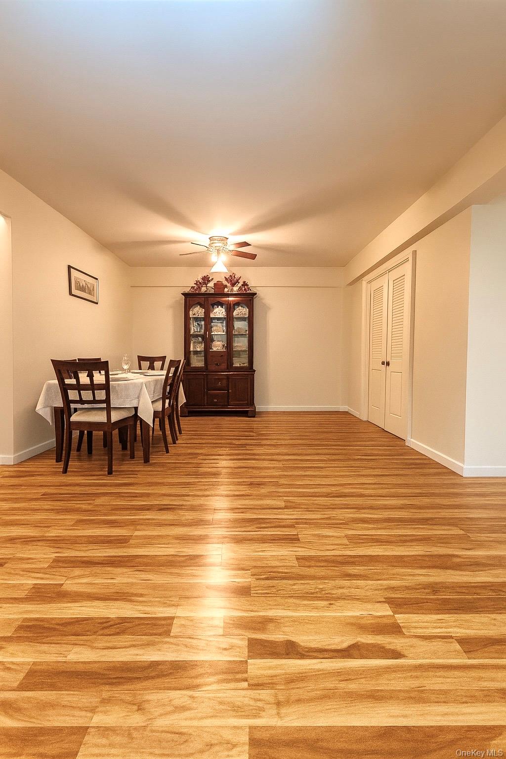 138-15 Franklin Avenue, Unit 221 Queens, NY 11355 - Photo 6 of 9 a view of a dining room with furniture and wooden floor