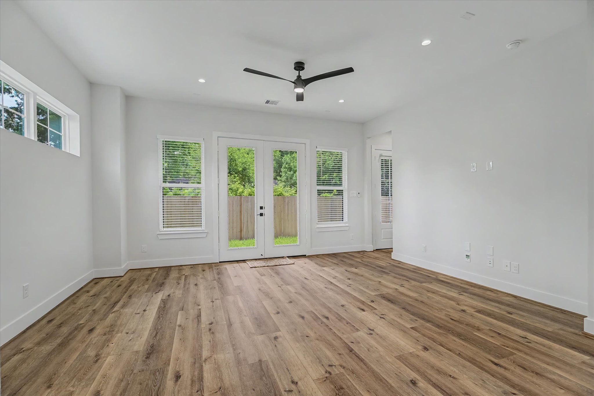 3806 Dreyfus Street Houston, TX 77021 - Photo 17 of 48 Spacious living room featuring French doors that open directly to the backyard. The room is equipped with TV outlets and is pre-wired for both alarm and stereo systems.
