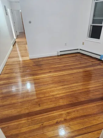 a view of bathroom and empty room