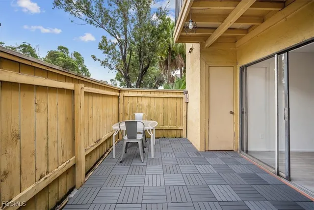 a view of a back yard from a balcony