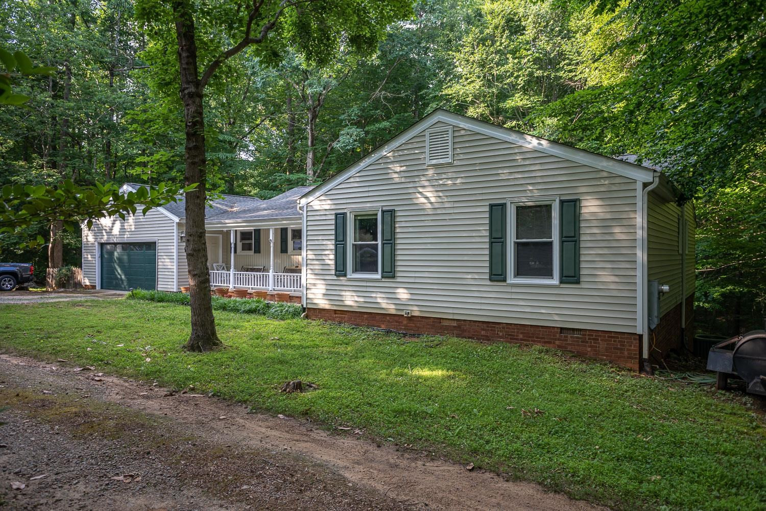 14401 Possum Track Road Raleigh, NC 27614 - Photo 28 of 30 Small open area immediately in front of home. Mature trees separate the home from the street. Exterior Front