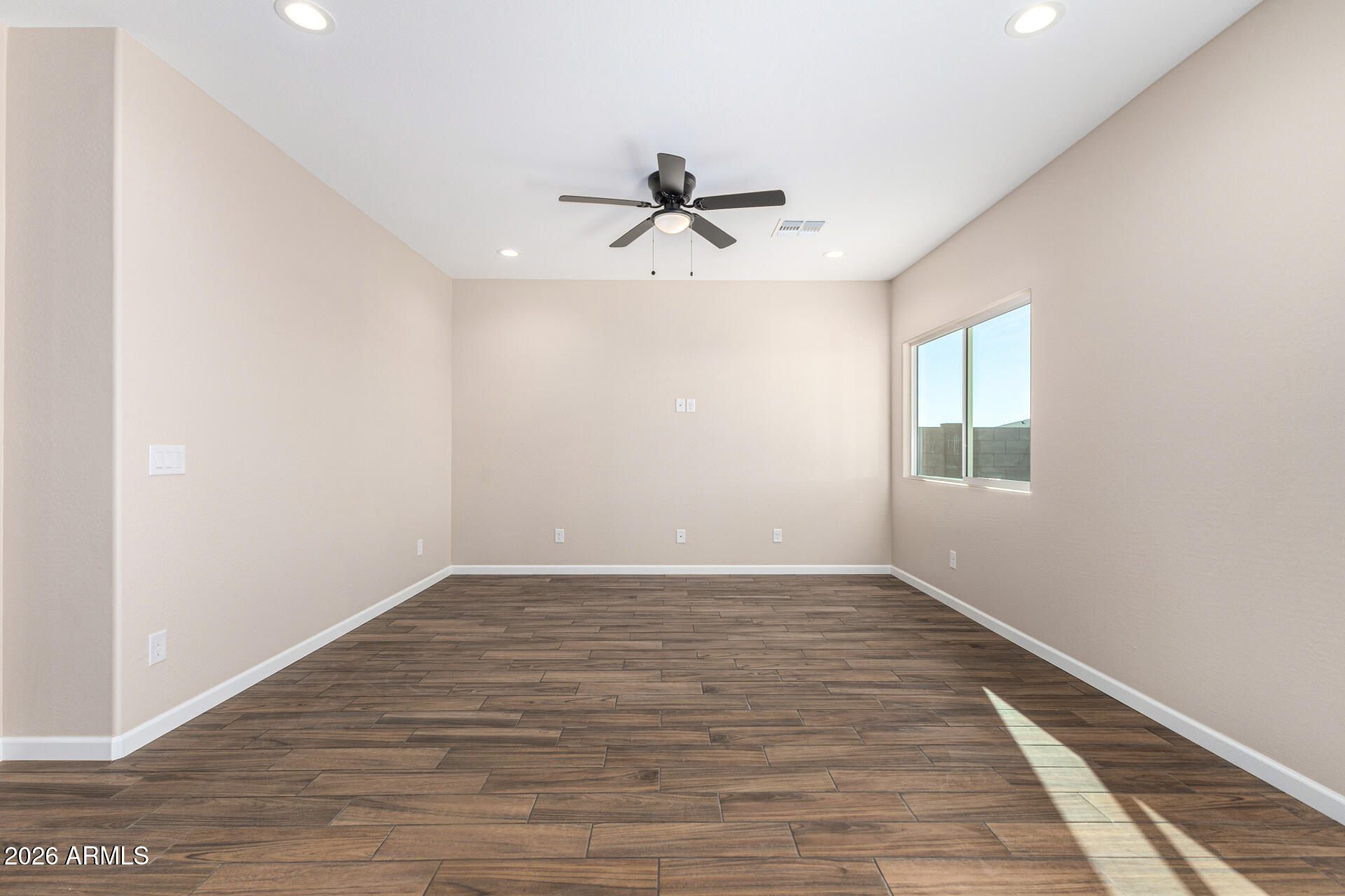 14058 South Tampico Road Arizona City, AZ 85123 - Photo 15 of 37 wooden floor in an empty room with a window