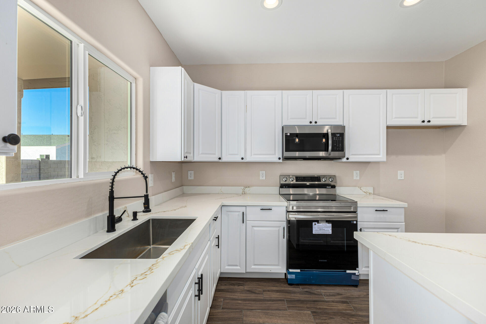 14058 South Tampico Road Arizona City, AZ 85123 - Photo 20 of 37 a kitchen with white cabinets appliances and sink