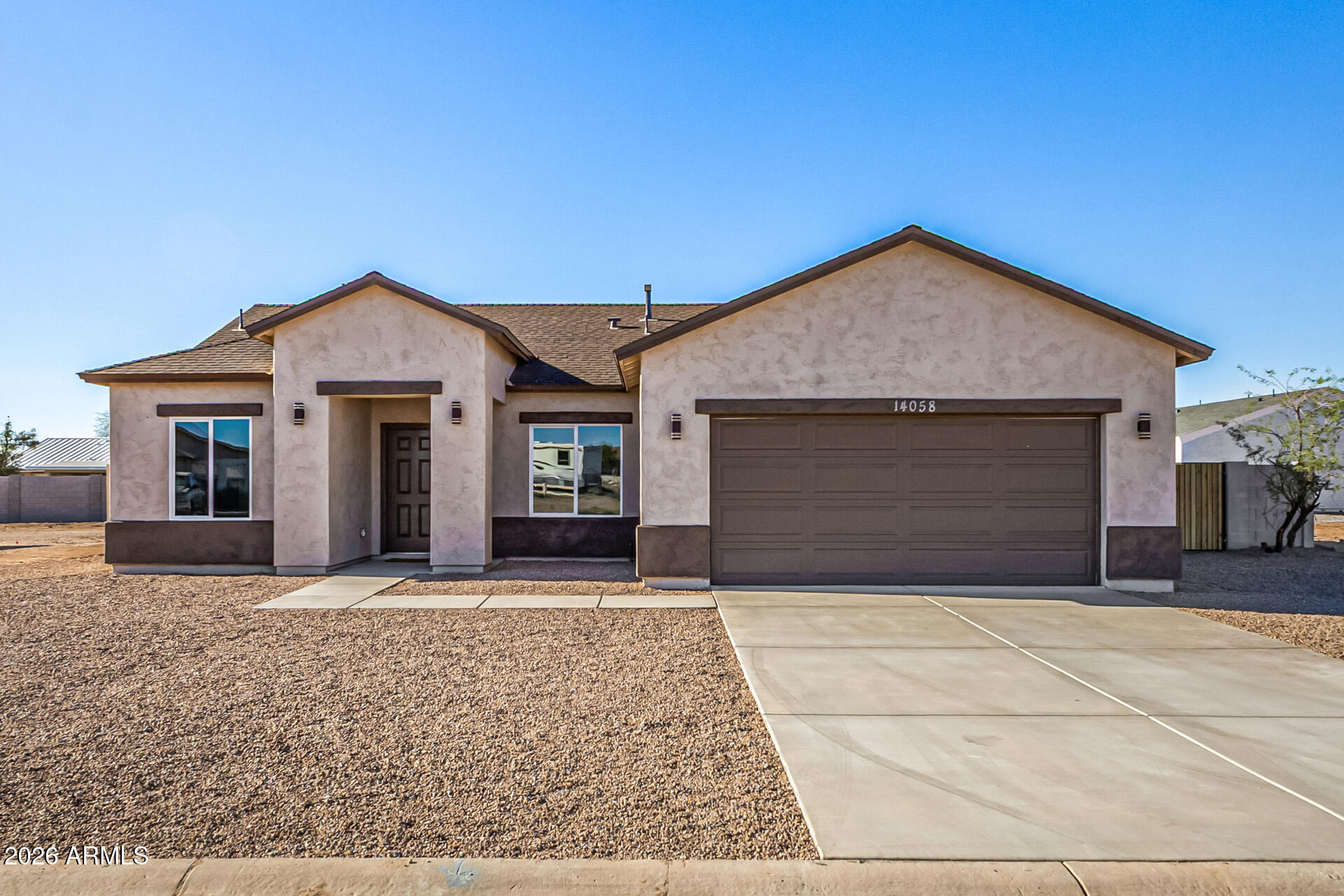 14058 South Tampico Road Arizona City, AZ 85123 - Photo 2 of 37 a front view of a house with yard