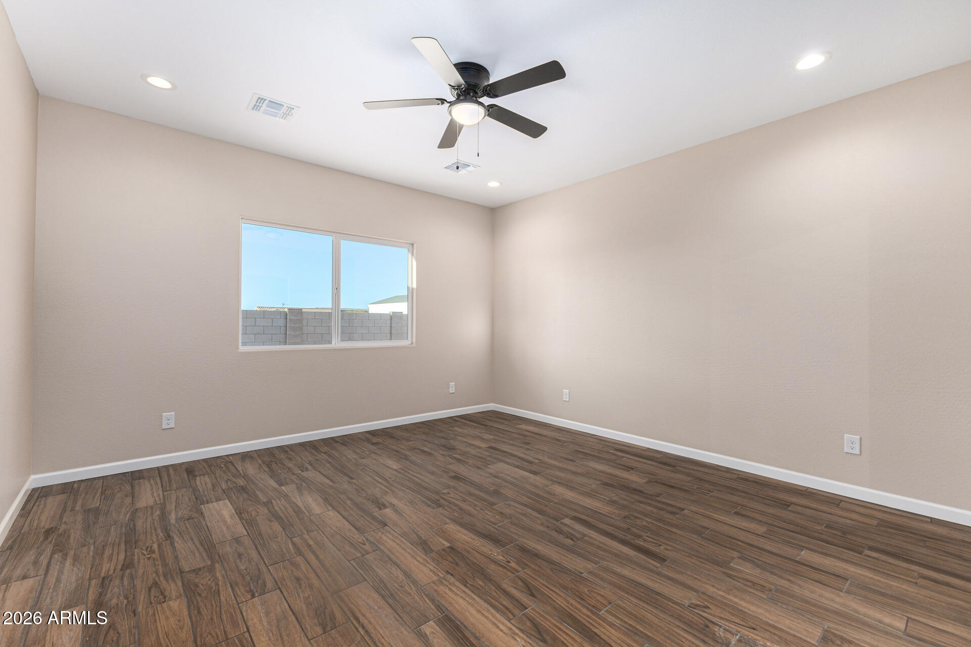 14058 South Tampico Road Arizona City, AZ 85123 - Photo 22 of 37 wooden floor in an empty room with a window