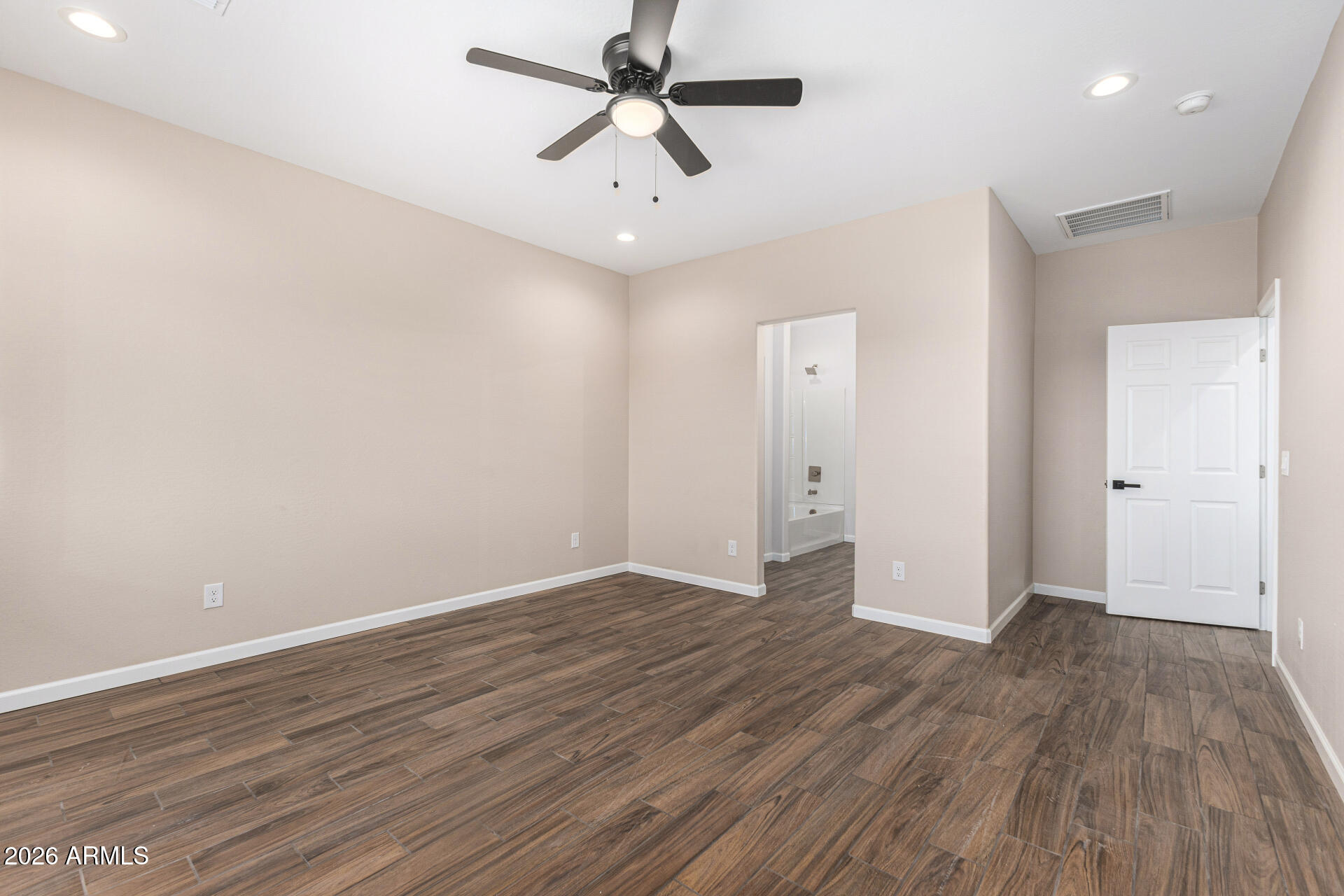 14058 South Tampico Road Arizona City, AZ 85123 - Photo 23 of 37 wooden floor in an empty room with a window