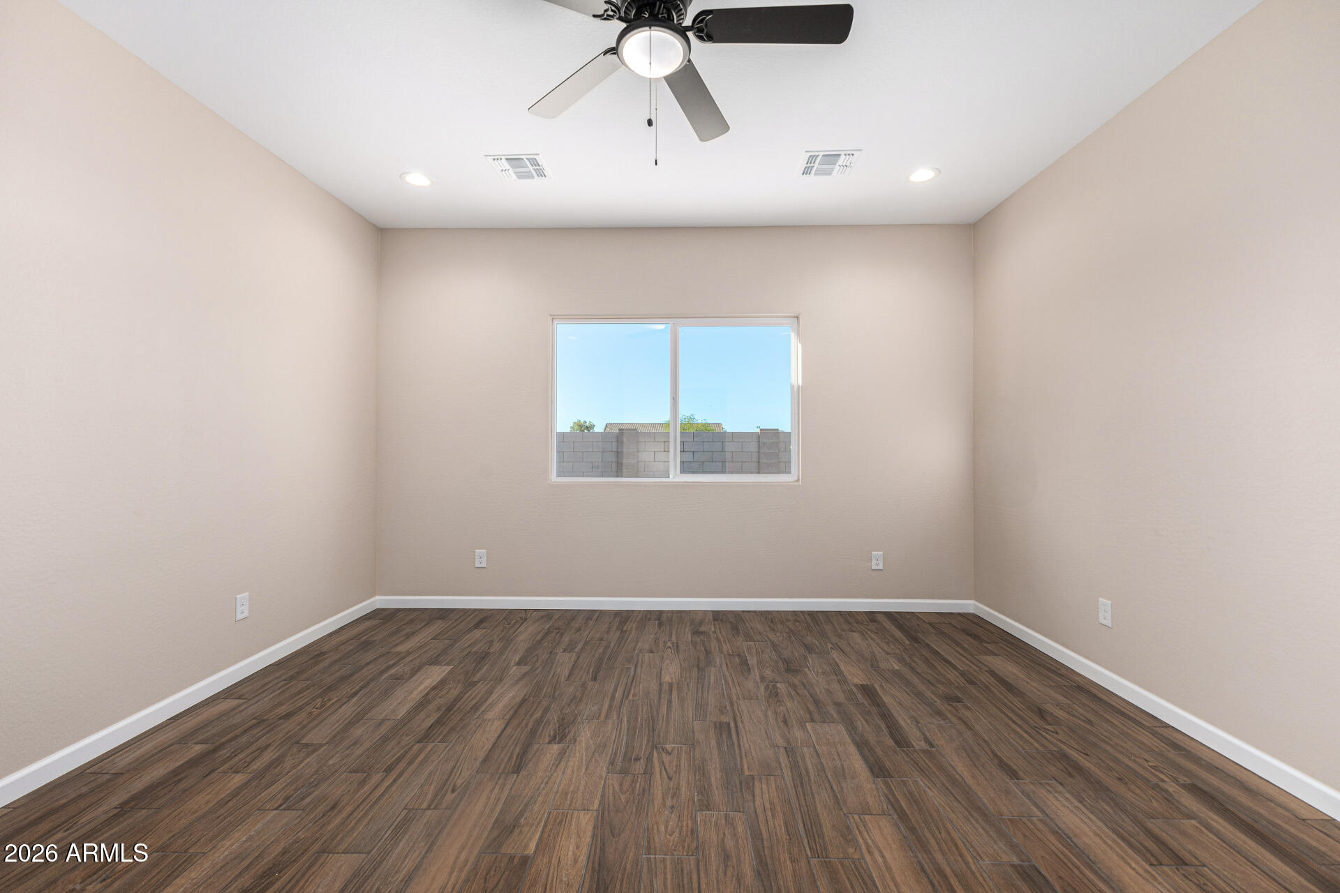 14058 South Tampico Road Arizona City, AZ 85123 - Photo 25 of 37 wooden floor in an empty room with a window