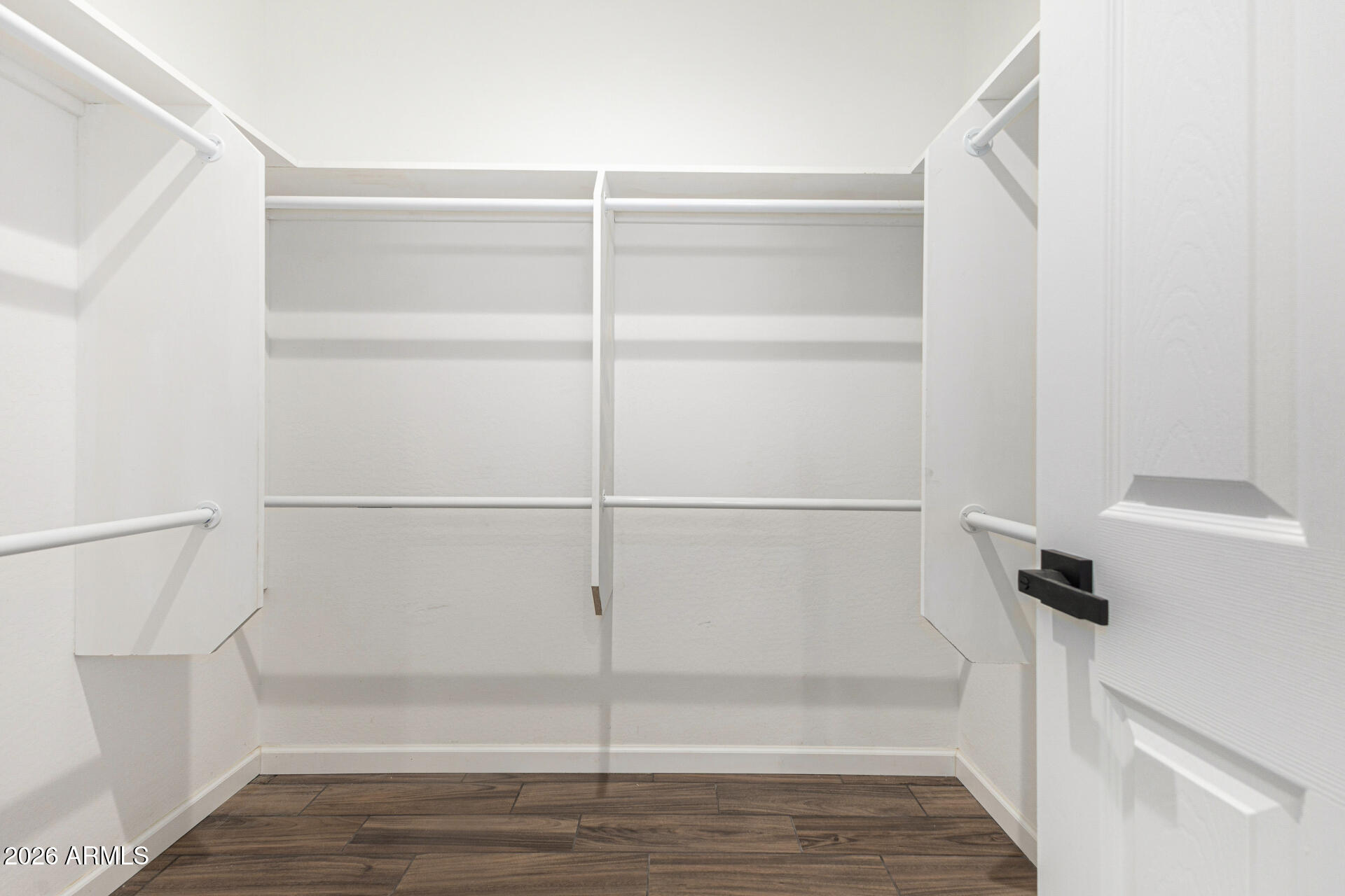 14058 South Tampico Road Arizona City, AZ 85123 - Photo 28 of 37 a view of walk in closet with empty racks