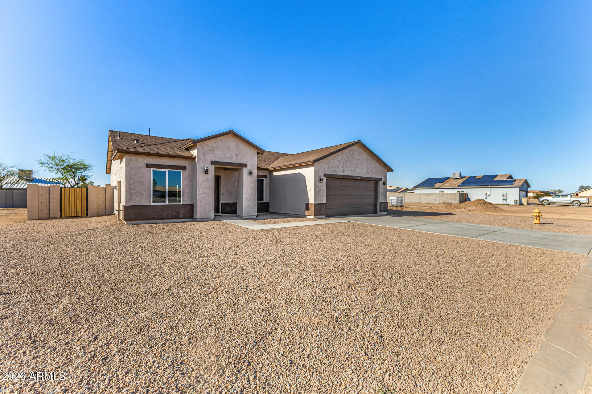 14058 South Tampico Road Arizona City, AZ 85123 - Photo 3 of 37 a view of a house with a yard and large tree