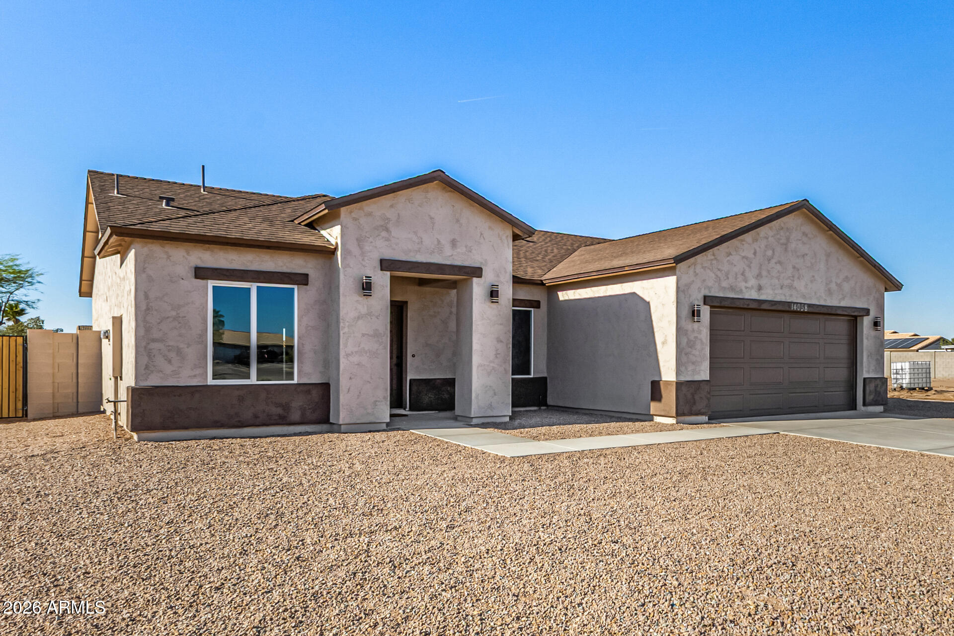 14058 South Tampico Road Arizona City, AZ 85123 - Photo 4 of 37 a front view of a house with a yard