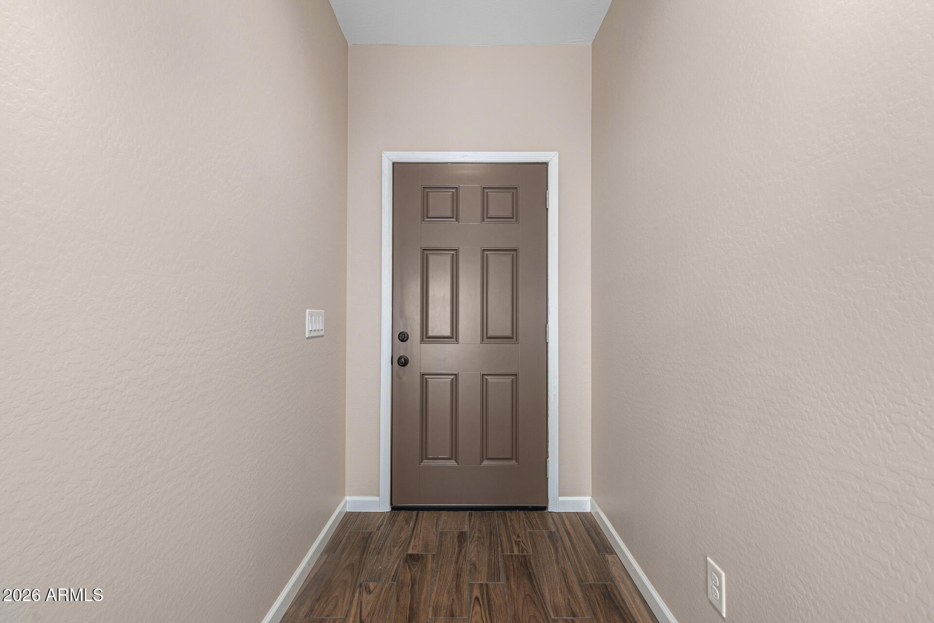 14058 South Tampico Road Arizona City, AZ 85123 - Photo 8 of 37 a view of front door with wooden floor