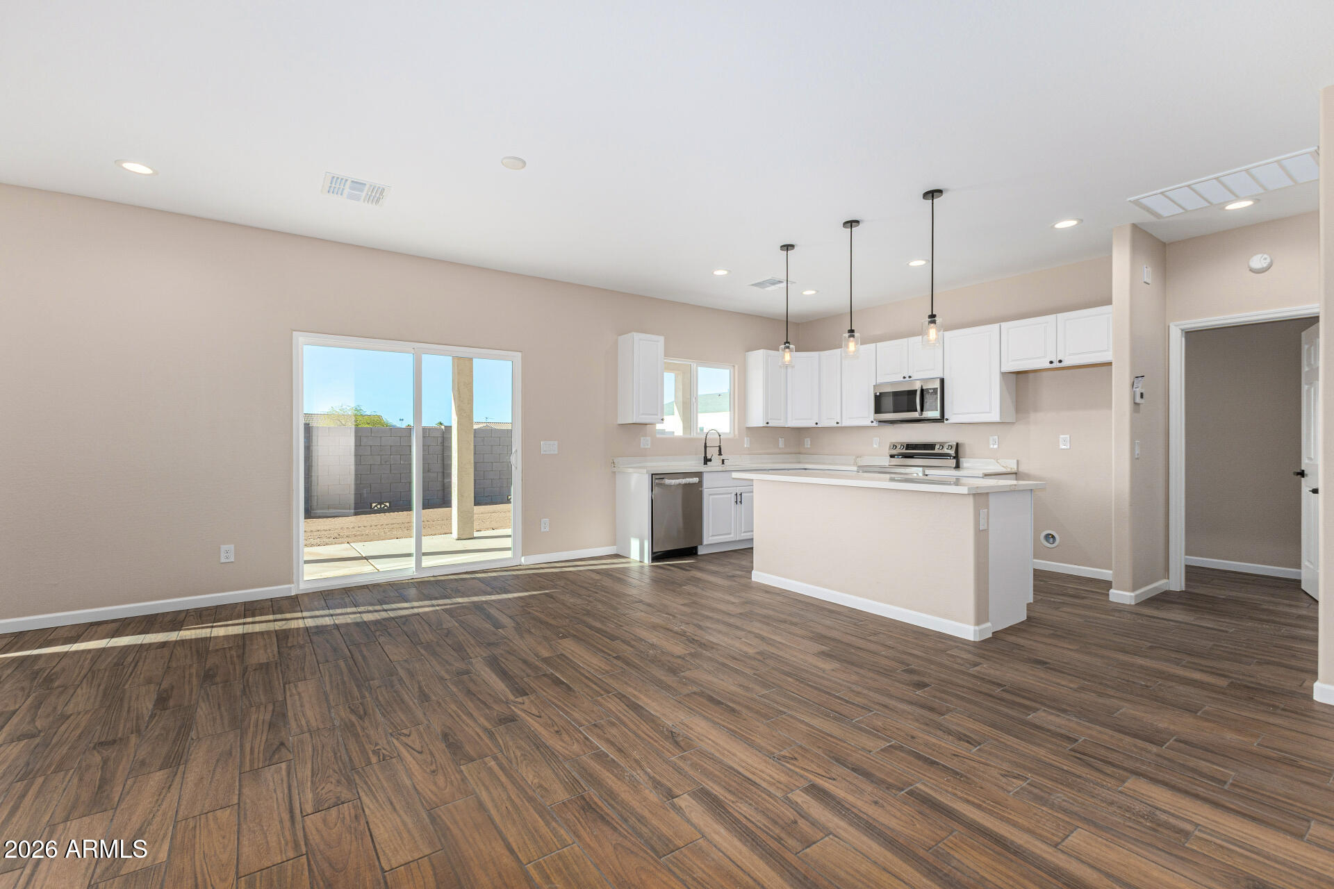 14058 South Tampico Road Arizona City, AZ 85123 - Photo 9 of 37 a view of kitchen with wooden floor and window