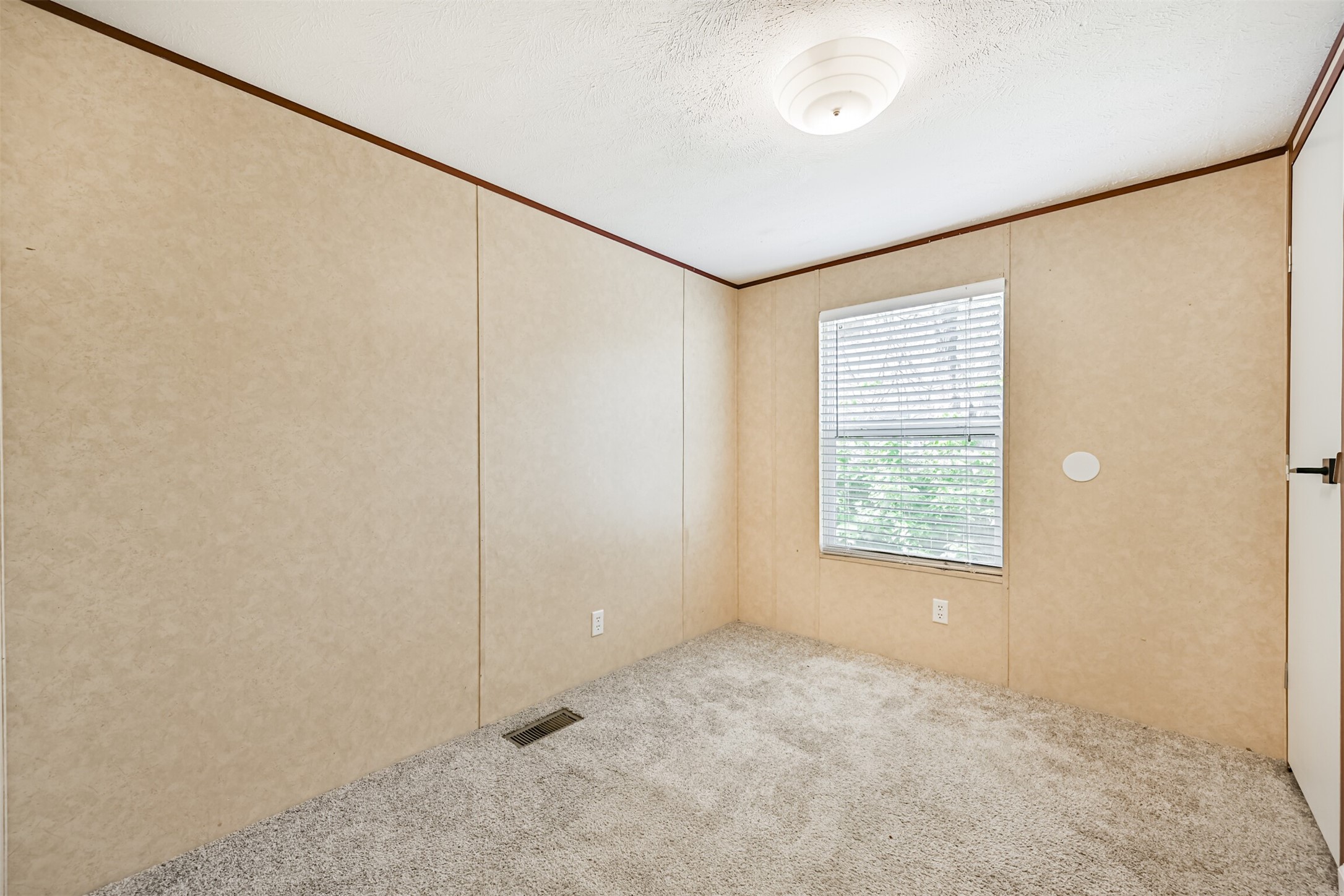 4702 10th Street Bacliff, TX 77518 - Photo 22 of 33 a view of an empty room with a window
