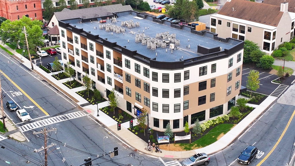 69 East Central Street, Unit 203 Natick, MA 01760 - Photo 12 of 12 a view of building with yard in front of it