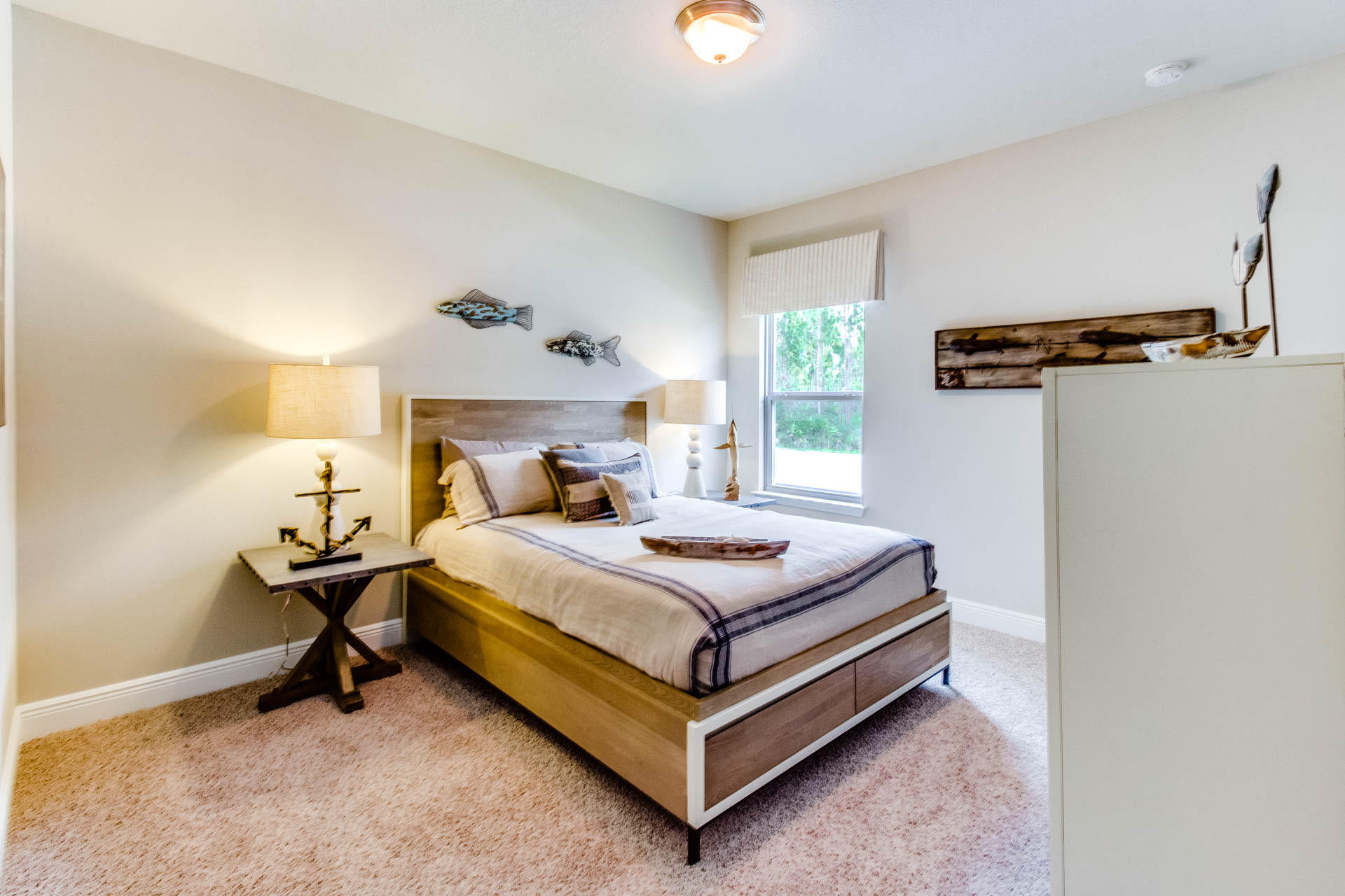 341 Wayne Trail Santa Rosa Beach, FL 32459 - Photo 20 of 37 a bedroom with a bed and a lamp on the dresser
