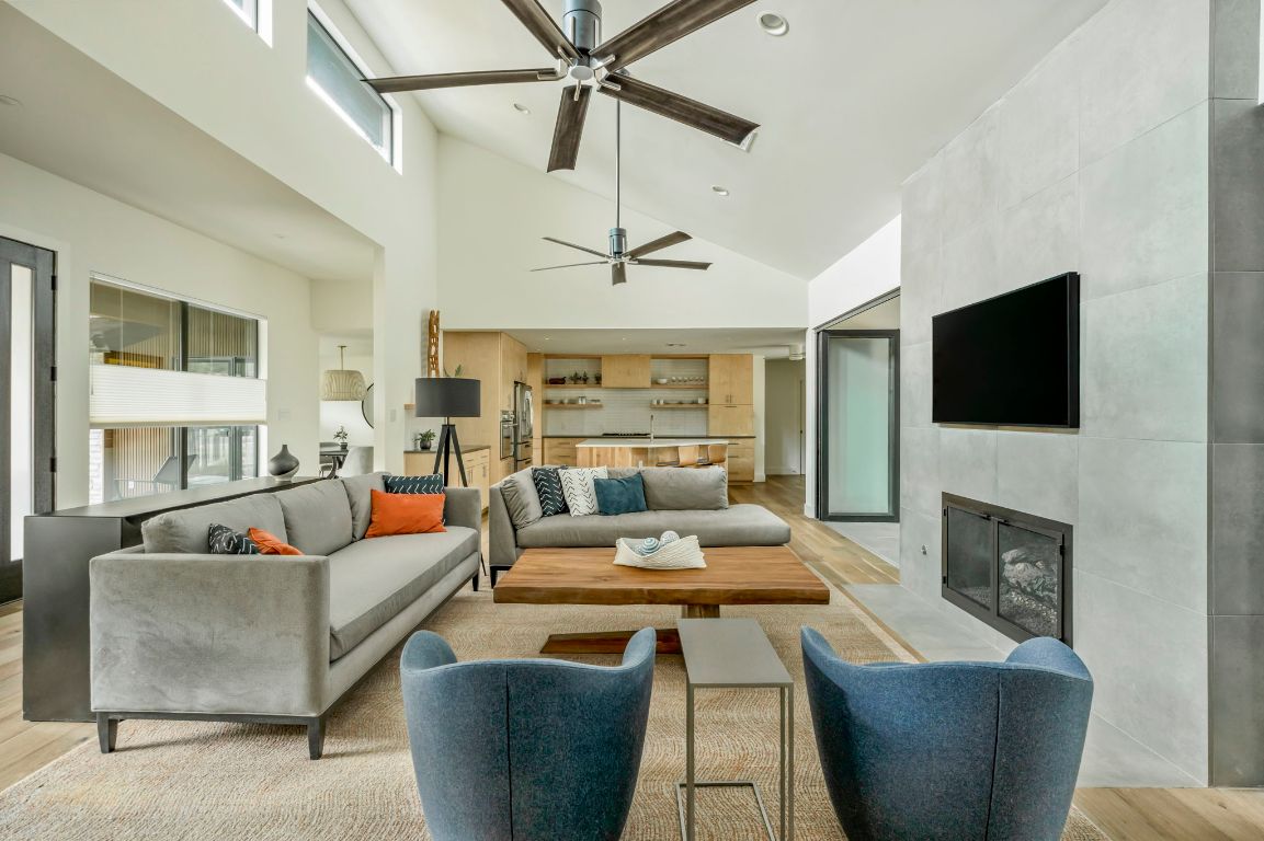 a living room with fireplace furniture and a flat screen tv