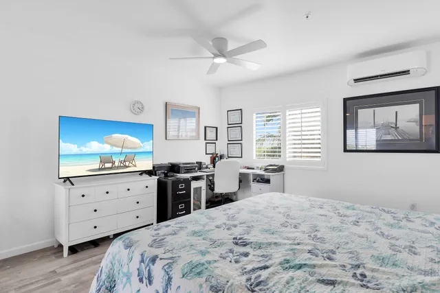 a view of a dining room with furniture and a window