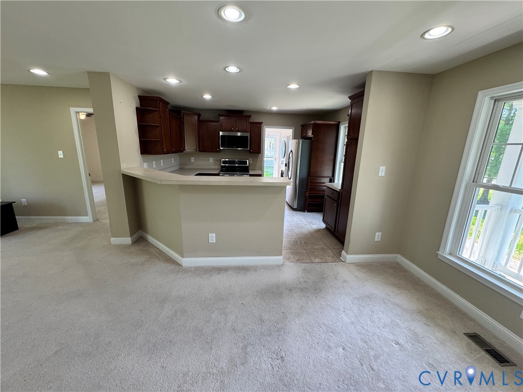 5541 Mary Ball Road Lancaster, VA 22503 - Photo 15 of 50 a view of kitchen with stainless steel appliances refrigerator stove microwave and cabinets