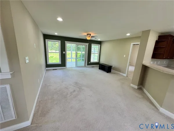 a view of an empty room with a window