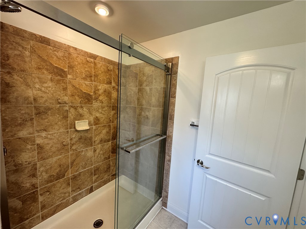 5541 Mary Ball Road Lancaster, VA 22503 - Photo 28 of 50 a bathroom with a glass shower door