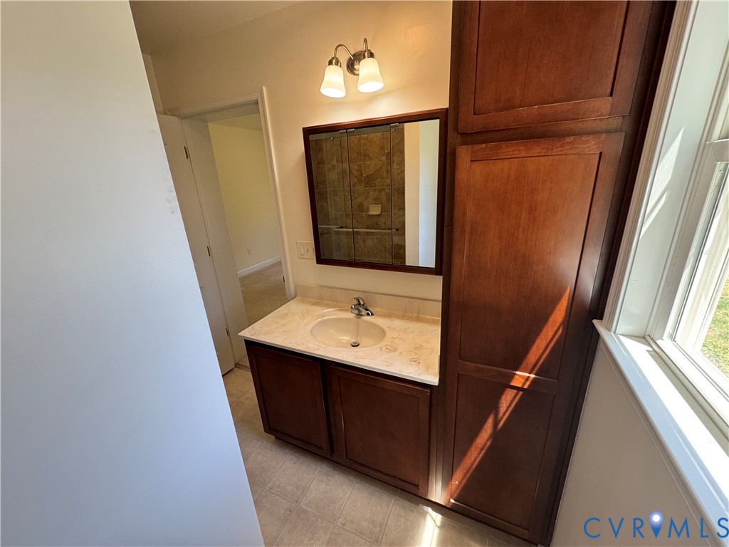 5541 Mary Ball Road Lancaster, VA 22503 - Photo 29 of 50 a bathroom with a sink a mirror and vanity