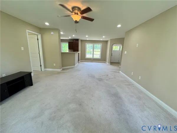 a view of a big room with windows and cabinet