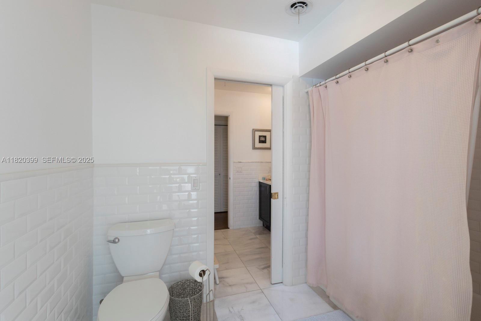 11900 Southwest 72nd Place Pinecrest, FL 33156 - Photo 25 of 37 a bathroom with a toilet and a shower