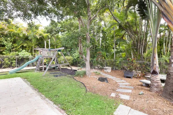 a view of a backyard with sitting area